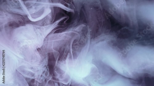 Abstract ink mixing in water, fluid art, slow motion background footage