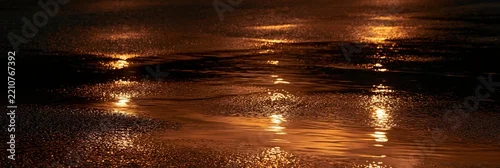 Panel kuchenny z motywem Reflective wet asphalt surface with golden light reflections at night