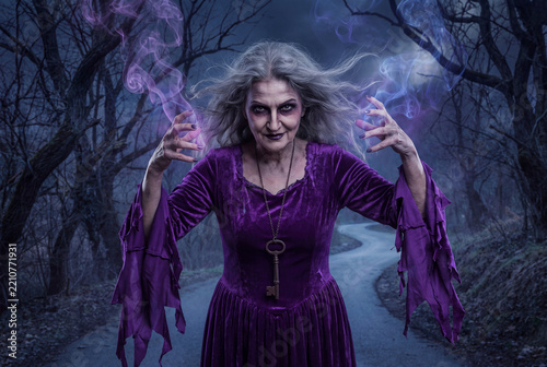 A sinister medieval witch casting dark magic with glowing purple smoke inside a haunted forest