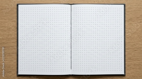 Blank Dot Grid Notebook Open on Wooden Table - Top View