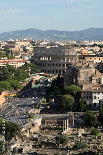 Obraz na plátně Rome rooftops and the Colosseum seen from above, Italy
