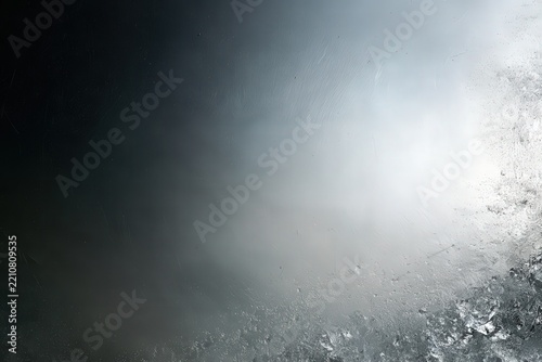 Extreme macro of smooth silver metal surface with dramatic light to dark gradient and fine brushed scratches