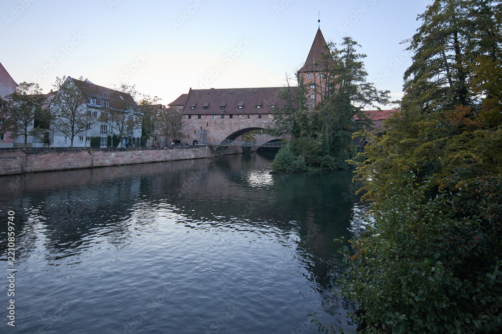 Fototapeta premium Historic medieval architecture and stone bridge over the Pegnitz river in Nuremberg Germany