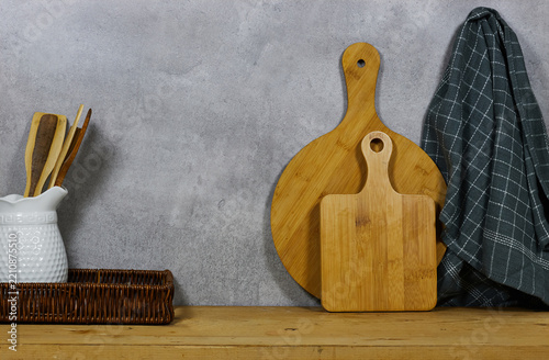 Rustic Wooden Cutting Boards and Kitchen Utensils on Countertop with Checked Towel Still Life