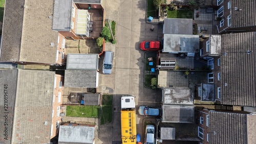 aerial view of refuse collecting lorry collecting domestic rubbish from homes using the wheelie bin system, City waste manage and recycling  
