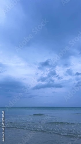 Dramatic Sunset Sky Over Calm Ocean Bay with Boats and Island Silhouette, vertical video  timelapse