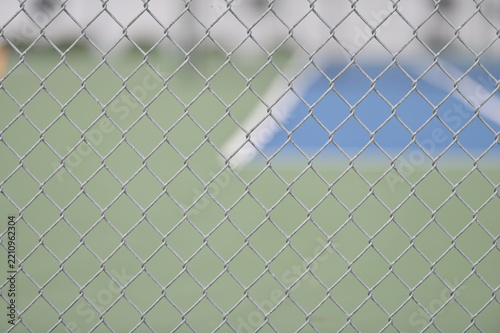 Chain Link Fence by a Tennis Court