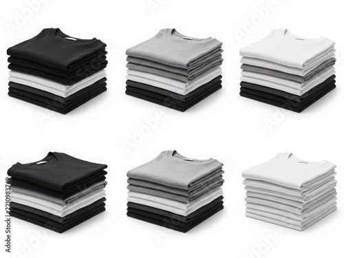Stack of neatly folded t-shirts in black, gray and white colors