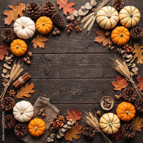 Autumn harvest pumpkins and pinecones arranged for seasonal fall