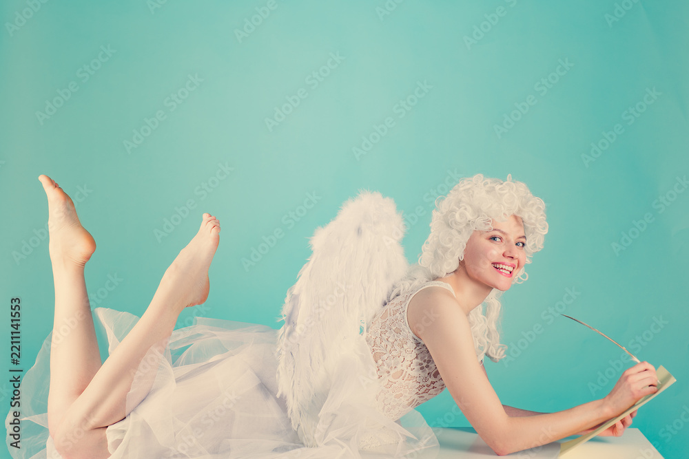 Obraz premium Valentine love letter with feather pen. Romantic Valentine angel writing on paper. Valentine message handwritten with a quill. Winged Valentine cupid composing a letter.