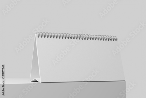 blank ring bound flip office desk calendar 10x5 inch wide horizontal placed on flat platform realistic mockup isolated 3d render eye level view