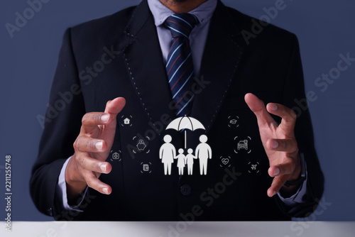 Business Person Showing Holographic Family Life Insurance Interface