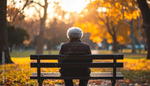 Elderly Woman Sitting on a Park Bench and Enjoying a Quiet Outdoor Moment