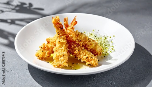 Crispy Golden Fried Tempura Shrimp Appetizer Served on a White Plate with Fresh Microgreens Garnish