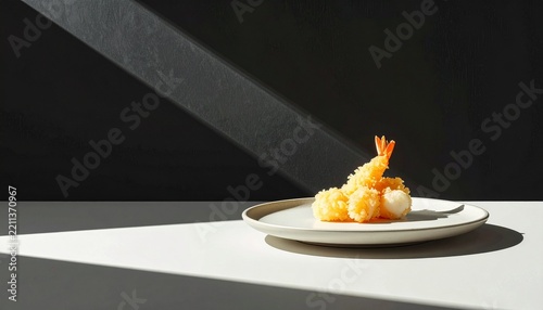 Crispy Japanese shrimp tempura served on a modern ceramic plate with dramatic shadows and minimalist presentation