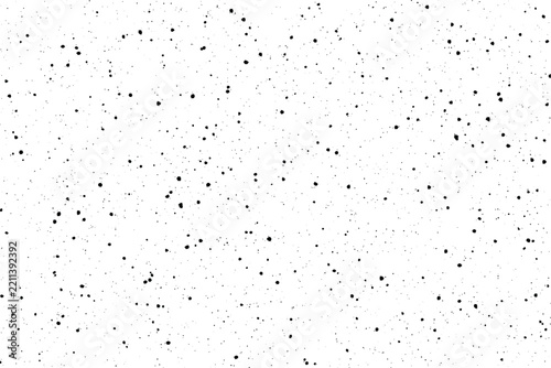 Monochrome grunge texture with black speckled dots and distressed background pattern