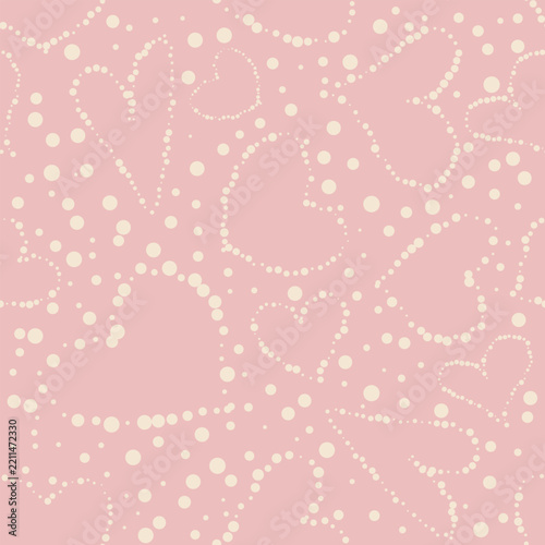 Seamless vector pattern with pastel dotted hearts on a pink background