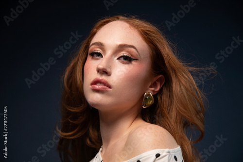 Woman in a yellow dress with windswept hair