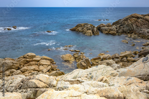 Long Exposure Seascape of Translucent Waves and Rugged Geological Rock Formations along Haeparang Trail in Yeongdeok, South Korea (Silky Smooth Water Surface and Exposed Coastal Rock Strata)