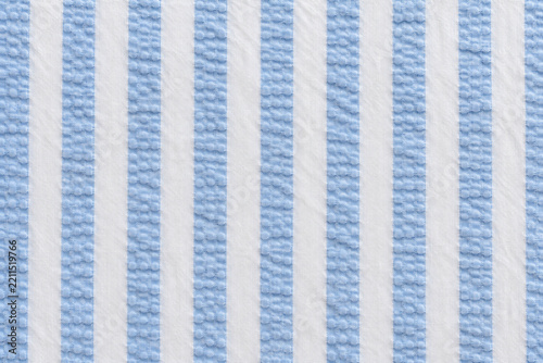 Seersucker pattern, puckered blue cotton stripe, textile background