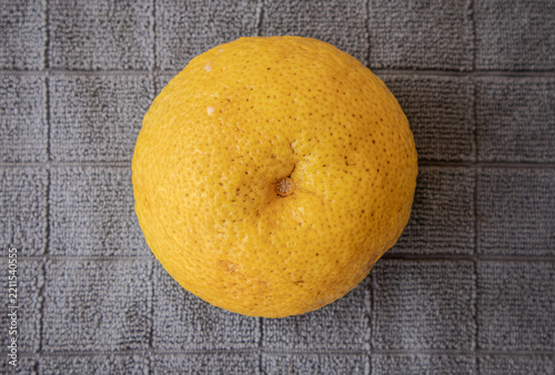Top view of a fresh yuzu fruit.