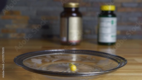 A man taking vitamins as his morning routine