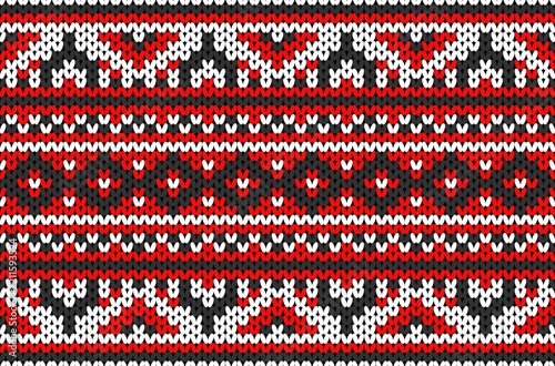 Seamless knitted pattern in red, white, and black with geometric motifs.