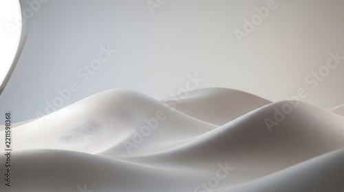 Smooth white abstract waves form a minimalist background with soft light.