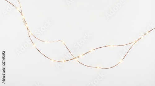 A string of LED lights arranged in a curved pattern against a plain white background. The lights are small and emit a warm, glowing light. 
