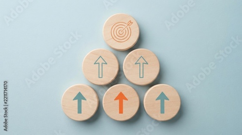 Wooden discs arranged in a pyramid with arrows