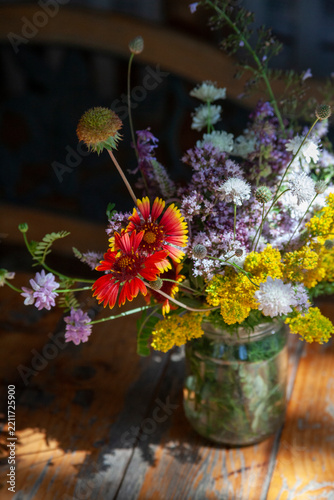 Bouquet of summer flowers on the garden background