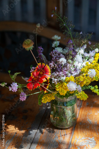 Bouquet of summer flowers on the garden background