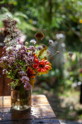 Bouquet of summer flowers on the garden background