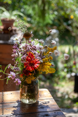 Bouquet of summer flowers on the garden background