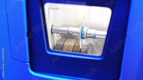 Opticians use professional gear to process lenses