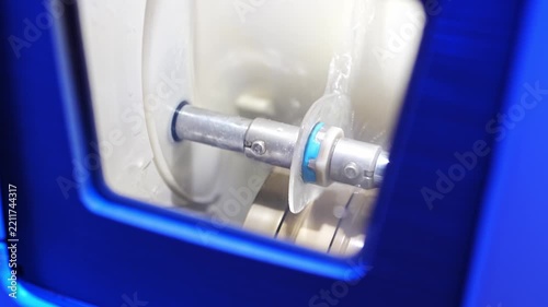 Optician using lens processing equipment for eyewear