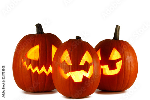 A classic bright orange Halloween jack-o'-lantern pumpkin smiling spookily