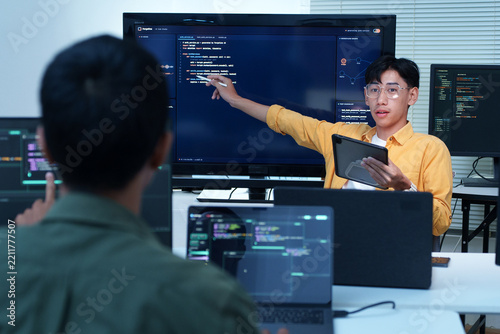 Software Engineer Presenting Code to Development Team