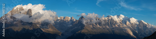 The panorama of Mont Blanc massif  Les Aiguilles towers, Grand Jorasses and Aiguille du Verte in sunset light.