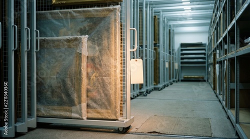 Museum Storage Corridor With Wrapped Paintings On Sliding Racks
