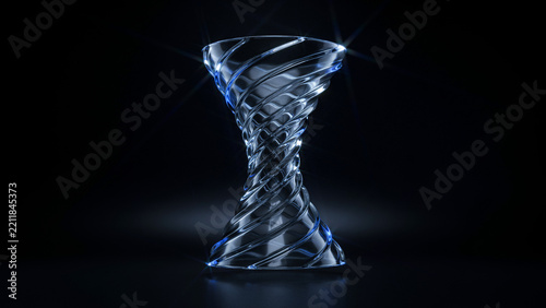 A swirling glass vortex sculpture glowing against a dark background