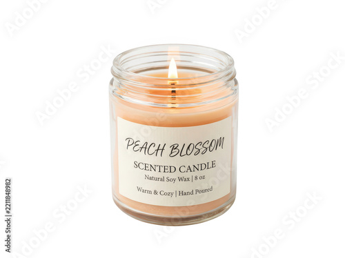 Candle in a glass jar with decorative label