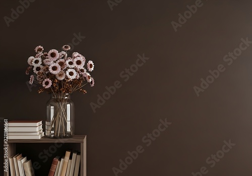Elegant white and red flowers in a clear vase on a bookshelf