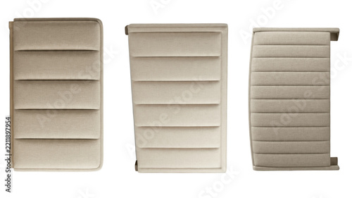 Fotografie Beige grooved upholstered cushions with textured surfaces