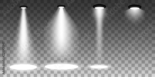 Set of four spotlights with white beams shining down on checkered background, stage lighting effect