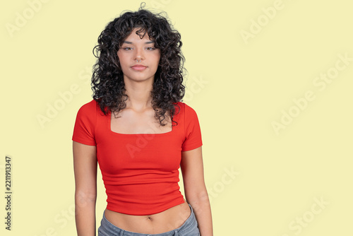 Confident young woman in red top