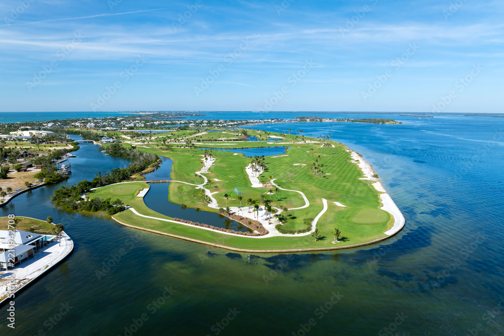 Obraz premium Big golf course field with green grass in Boca Grande, small town on Gasparilla Island in southwest Florida