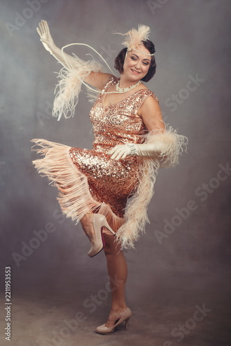 1920s Flapper Woman in Sequin Fringe Dress Dancing Charleston - Great Gatsby Style