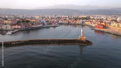 View of Chania with the amazing lighthouse, mosque, venetian shipyards, Crete, Greece.Waves crashing on lighthouse, Beautiful Greece and best scenic places - panorama