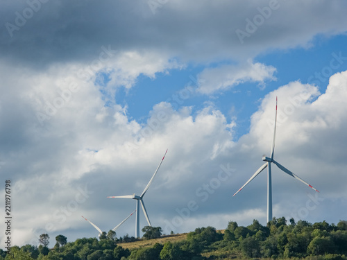 Obraz na plátně Wind Turbines Generating Clean Renewable Energy on Mountain Hills